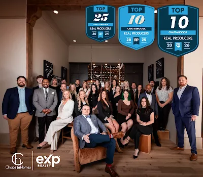 The Choice Homes team at their Chattanooga office, with eXp Realty and Top Producer award badges